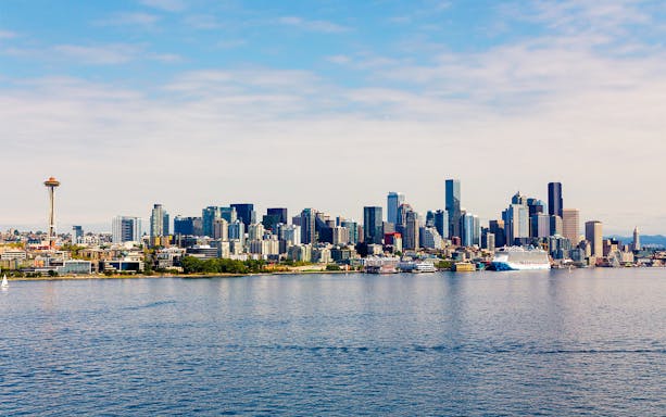 Seattle skyline with Space Needle viewed from a cruise on the water.