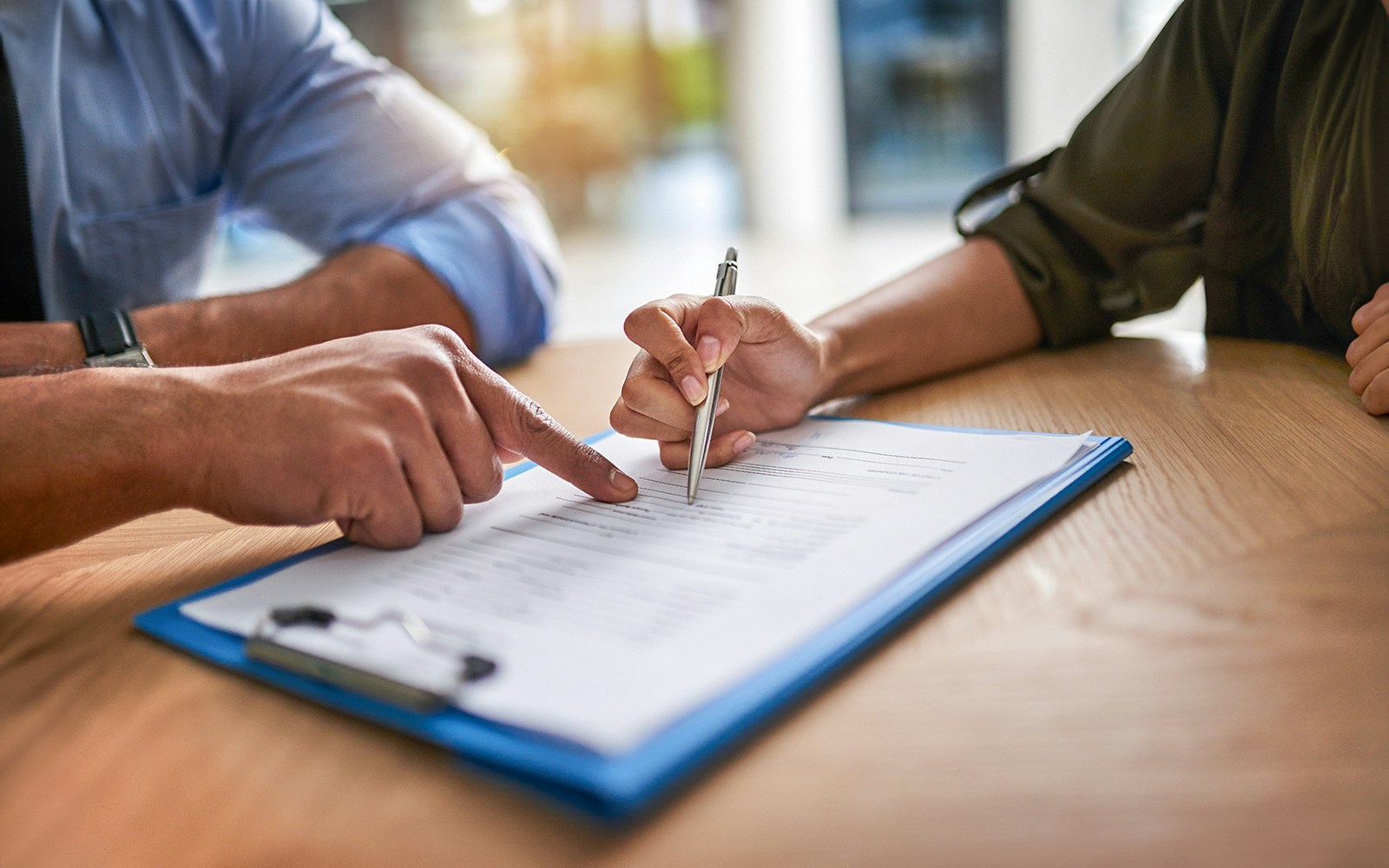 A person signing a contract, Dubai Skydiving
