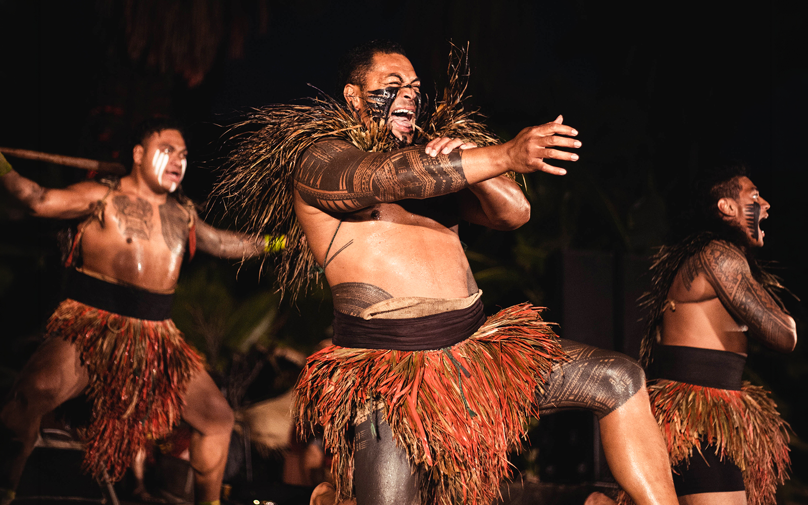 Performers in traditional attire at Chief's Luau, Oahu, Hawaii.