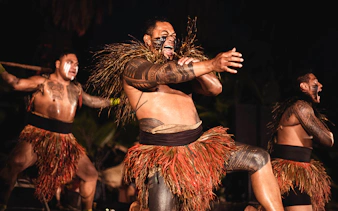 Performers in traditional attire at Chief's Luau, Oahu, Hawaii.