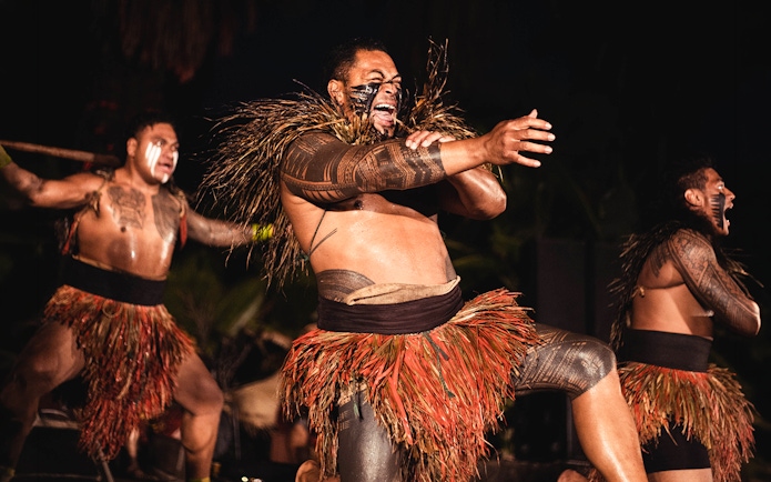 Performers in traditional attire at Chief's Luau, Oahu, Hawaii.