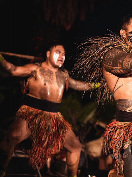 Performers in traditional attire at Chief's Luau, Oahu, Hawaii.