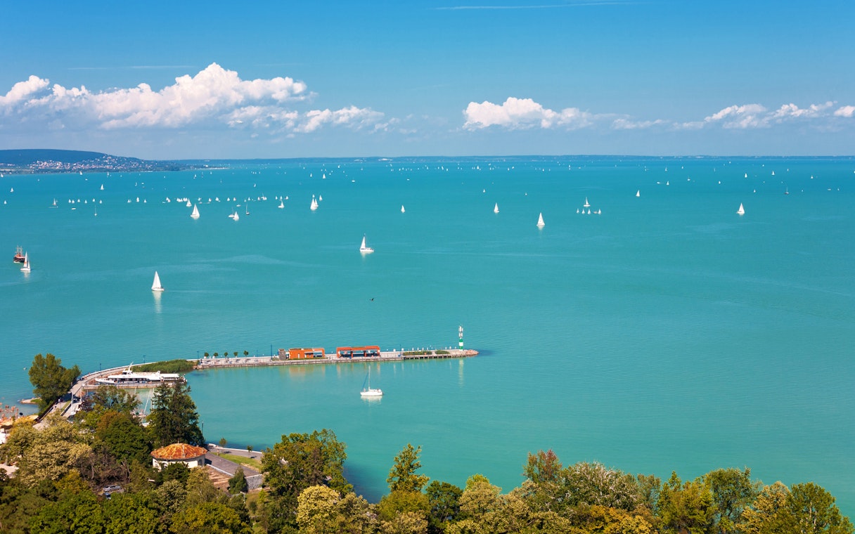 Sailboats on Lake Balaton with Tihany Peninsula in the distance, Hungary.