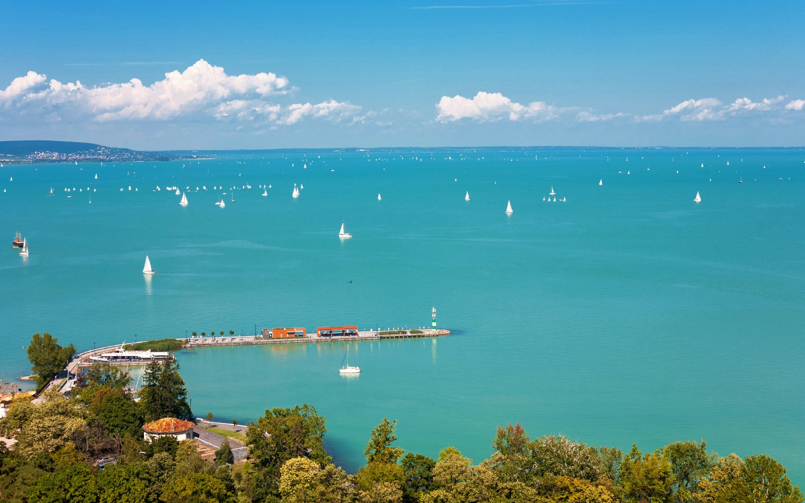 Sailboats on Lake Balaton with Tihany Peninsula in the distance, Hungary.