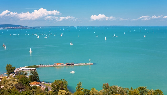 Sailboats on Lake Balaton with Tihany Peninsula in the distance, Hungary.