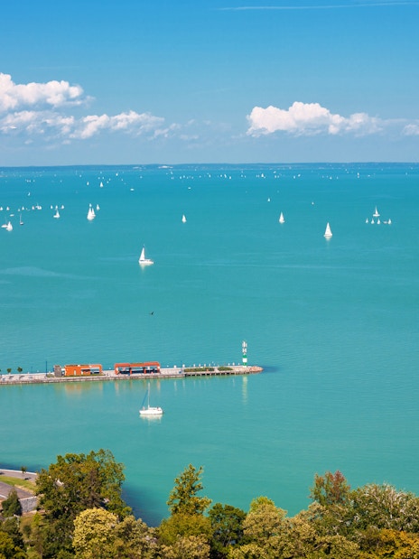 Sailboats on Lake Balaton with Tihany Peninsula in the distance, Hungary.