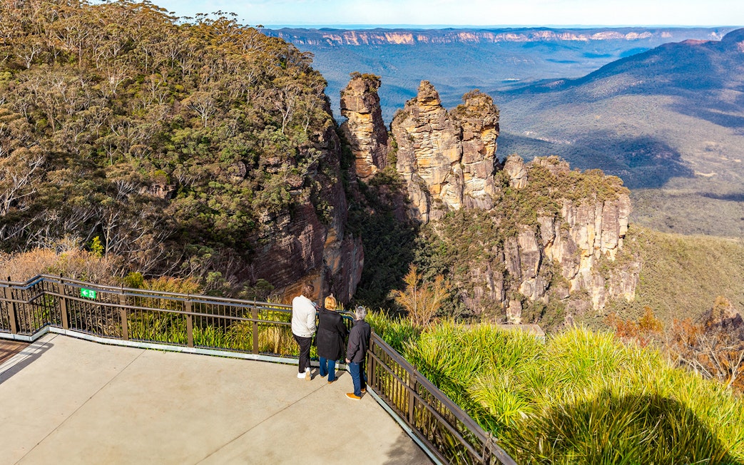 Visitors at Echo Point viewing the Three Sisters rock formation, Blue Mountains, Australia.