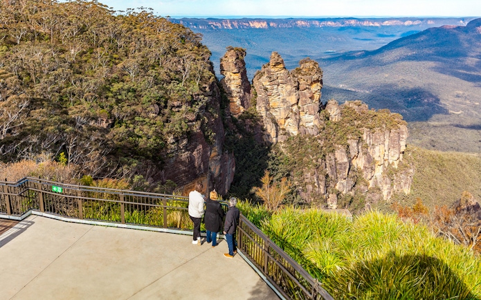 Visitors at Echo Point viewing the Three Sisters rock formation, Blue Mountains, Australia.