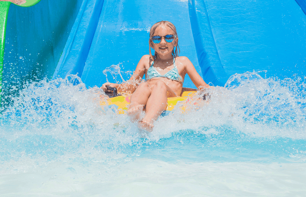 Girl on water slide at aquapark