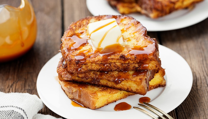 French toasts with butter and caramel sauce for breakfast.
