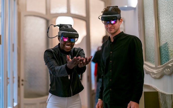 Visitors using VR headsets at La Pedrera in Barcelona.