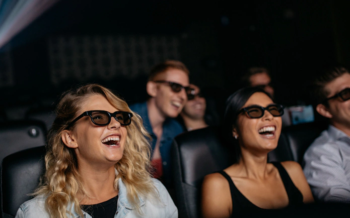 Visitors enjoying a 3D movie experience at the Intrepid Museum.
