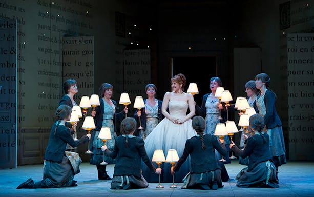 Cinderella surrounded by performers holding lamps at Sydney Lyric Theatre.