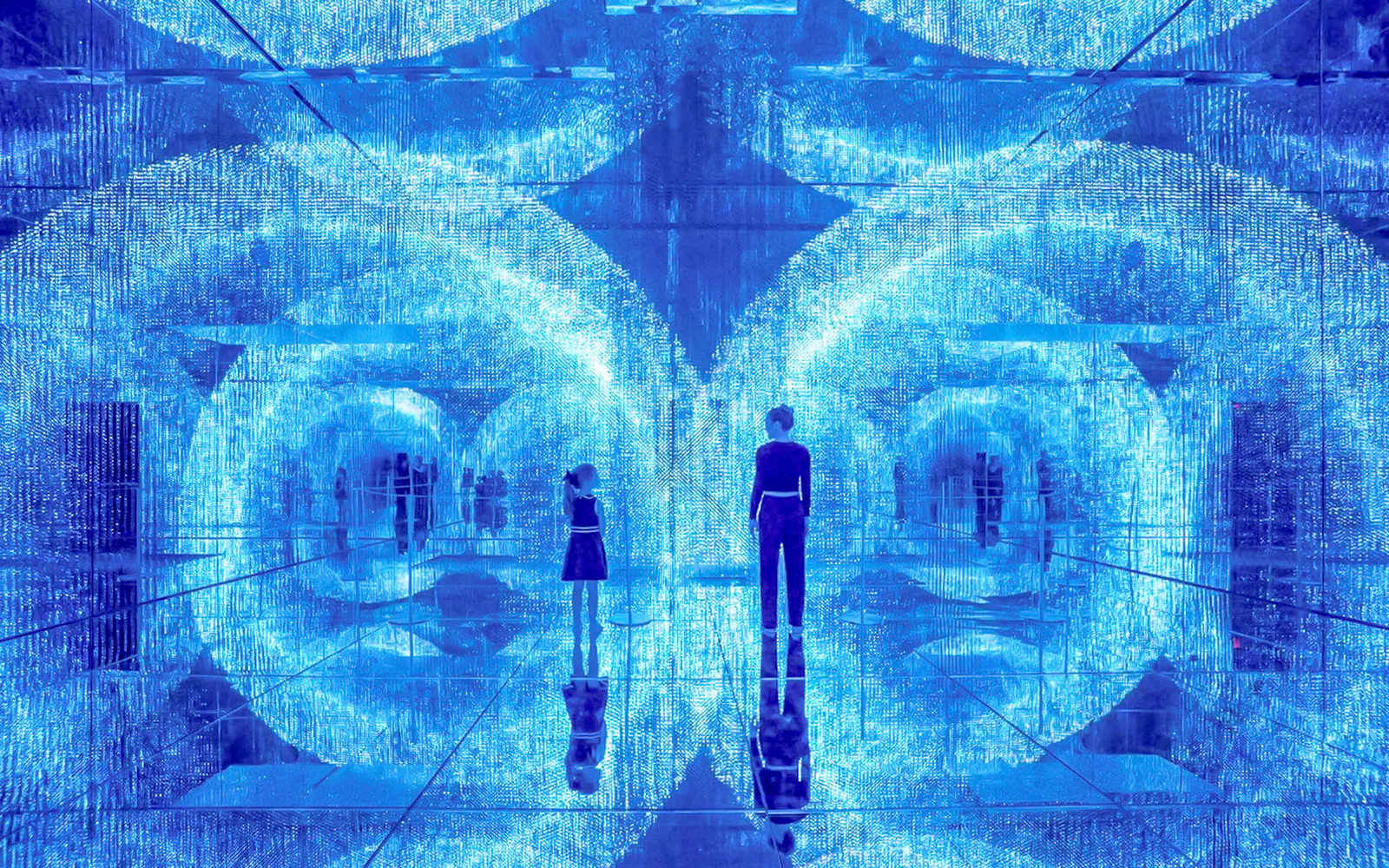 Visitors exploring immersive light installation at Mercer Labs Museum of Art.