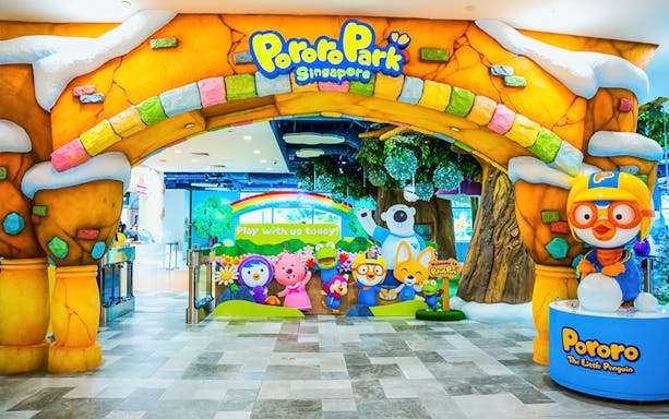 Entrance to Pororo Park Singapore with colorful characters and signage.