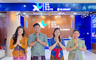Staff at Bali airport SIM card collection point, welcoming visitors.