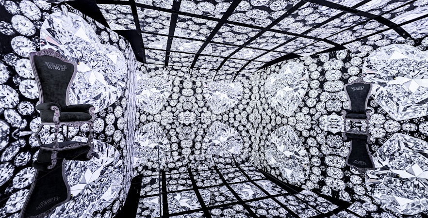 MIRACLEWORLD Osaka room with diamond-patterned walls and ornate chairs.