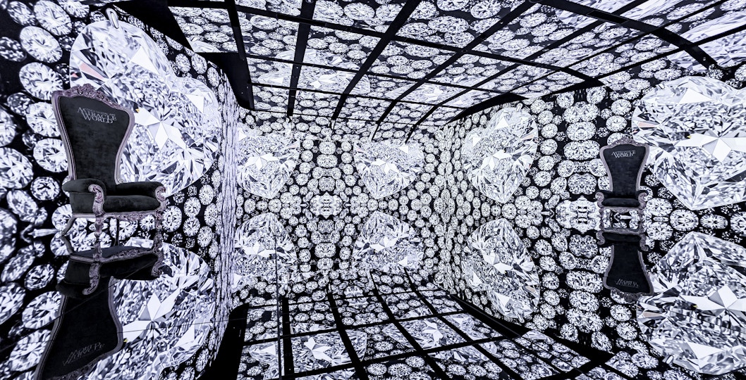 MIRACLEWORLD Osaka room with diamond-patterned walls and ornate chairs.