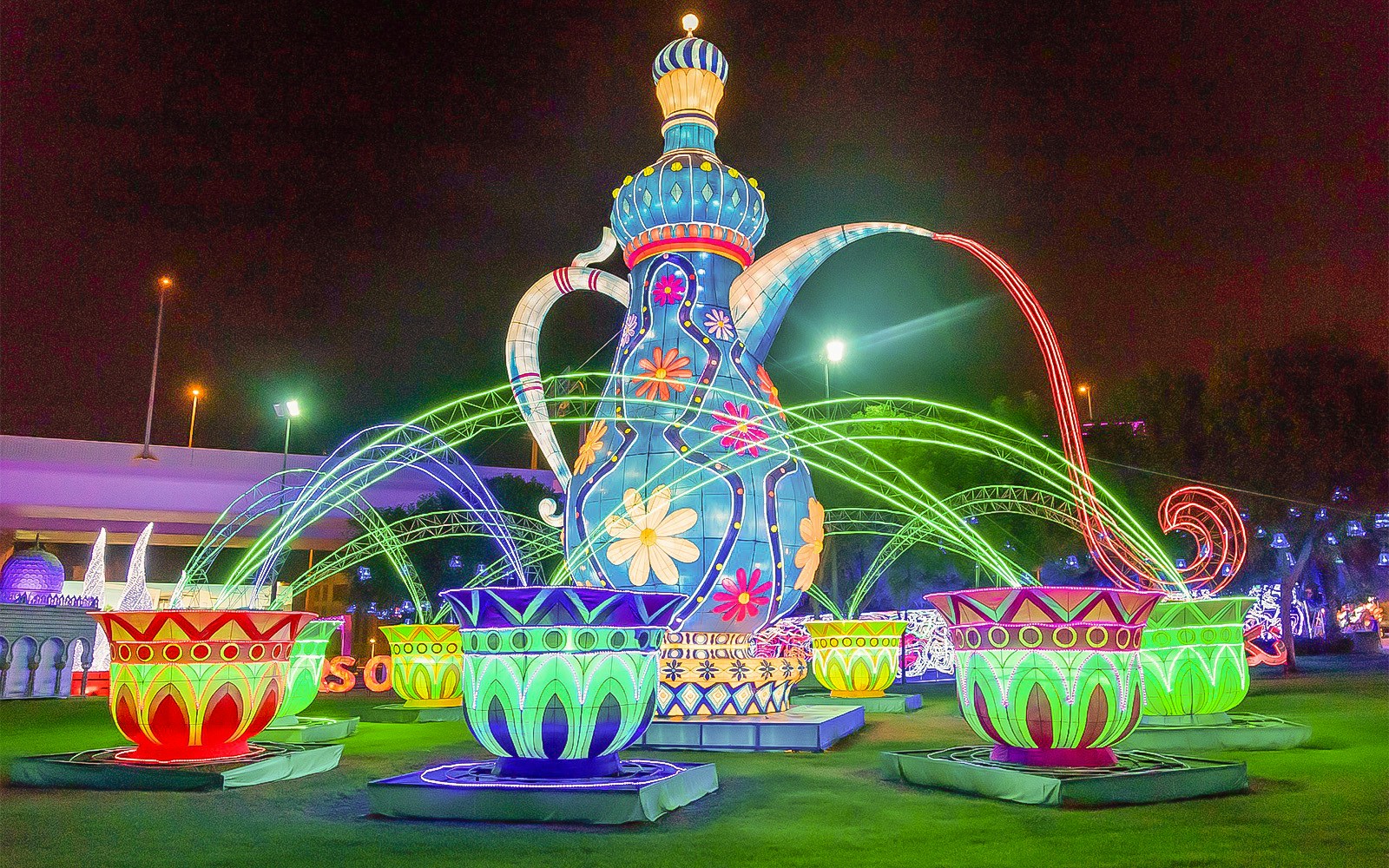 Dubai Garden Glow illuminated sculptures and light displays at night.