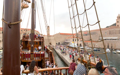 Tourists on a Game of Thrones-themed ship in Dubrovnik harbor, Croatia.