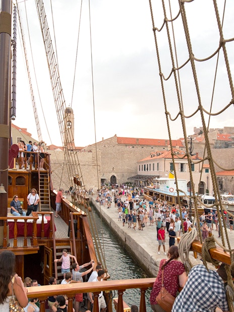 Tourists on a Game of Thrones-themed ship in Dubrovnik harbor, Croatia.