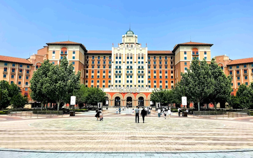 Entrance to Universal Studios Beijing with people walking in the plaza, China.