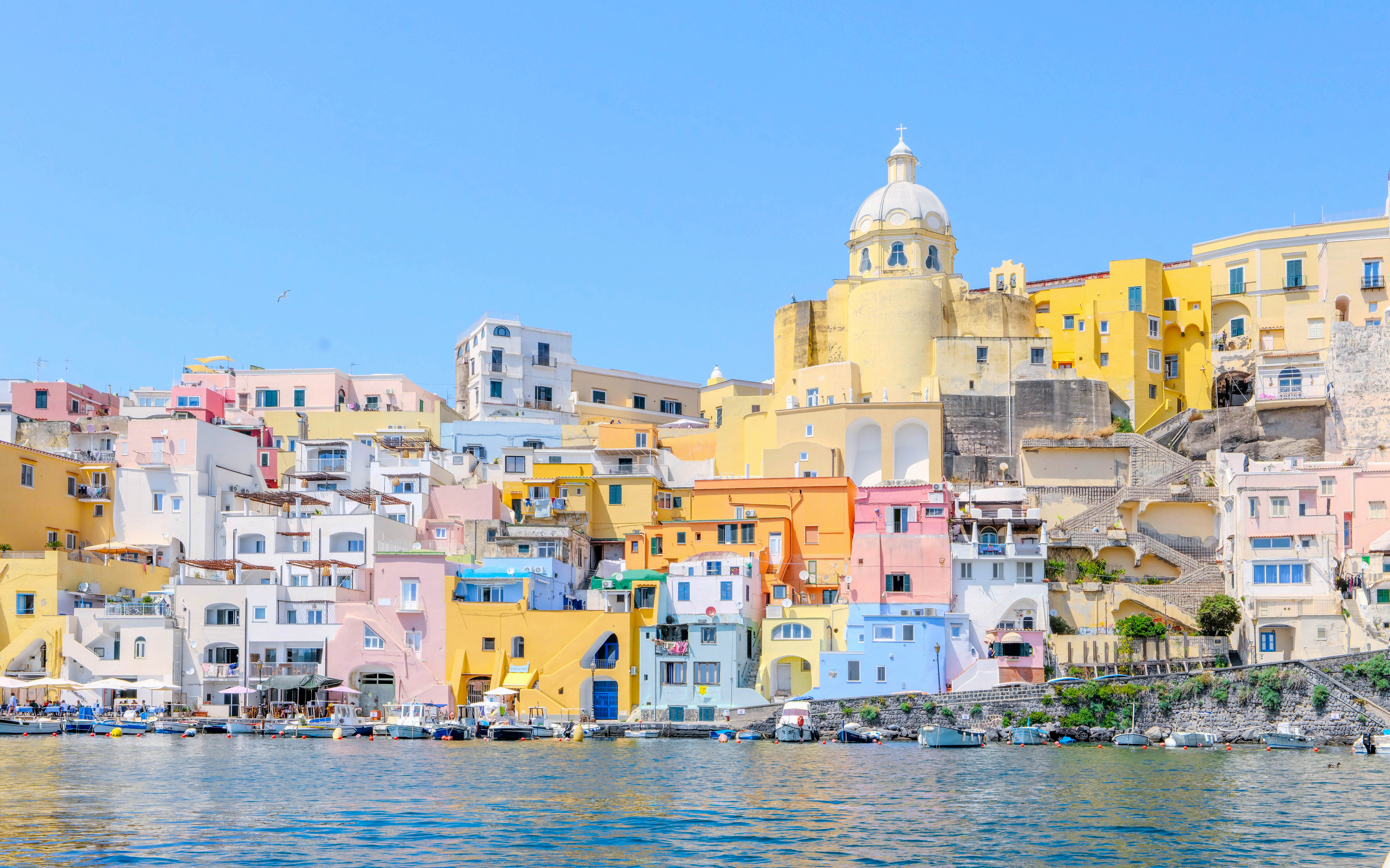 Colorful buildings along the waterfront of Procida Island, Italy.