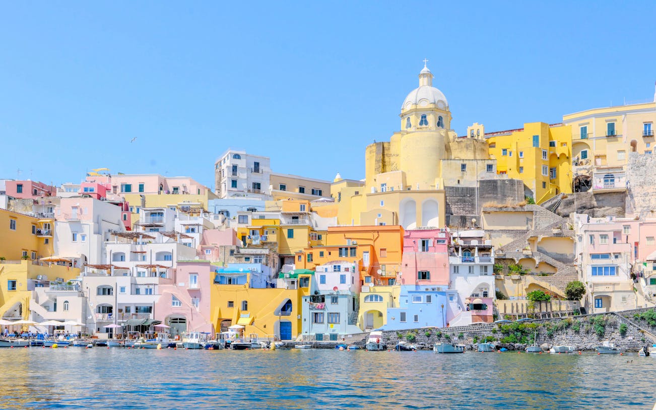 Colorful buildings along the waterfront of Procida Island, Italy.