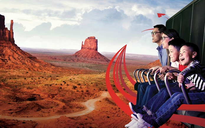 Family enjoying a virtual ride over Monument Valley with Go City: Las Vegas Explorer.