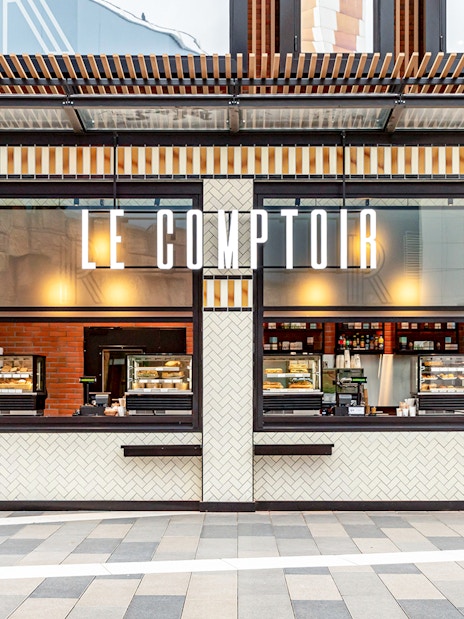 Facade of Rosalie’s Snack & Go with menu display and food counters.