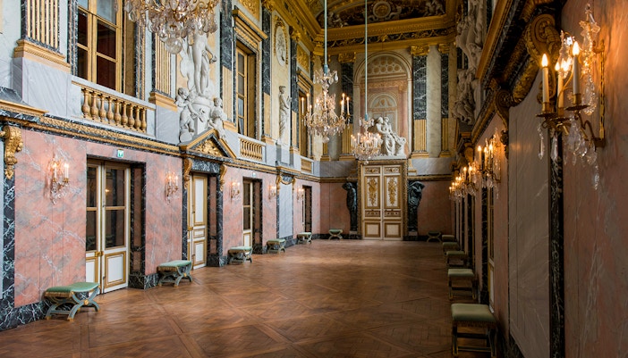 Outside entrance of Royal Opera House in Versailles with ornate architecture and grand facade.