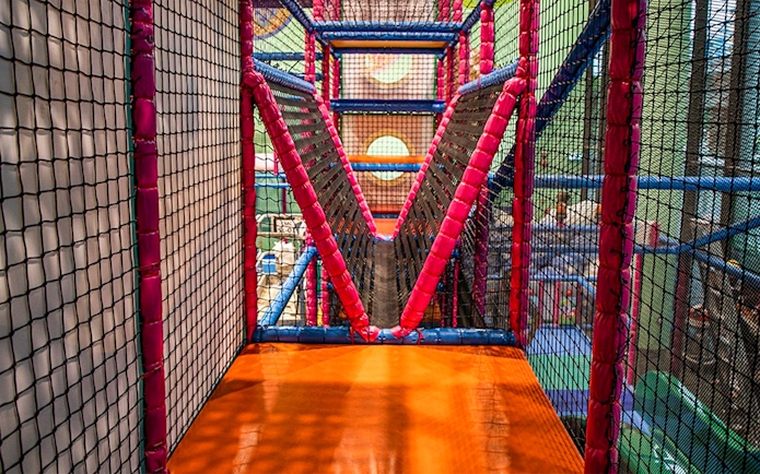 Indoor play area with netted bridge at T-Play Khatib.