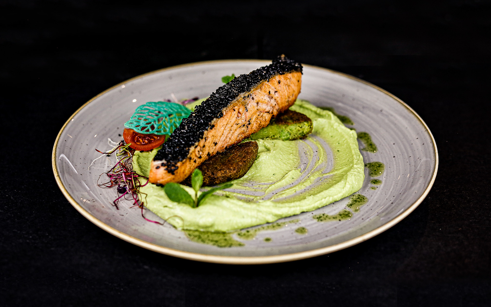 Black sesame crusted salmon with chili-mint pea purée on Budapest Dinner Cruise.