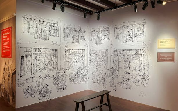 Mural depicting historical street scenes at Interior Chinatown Heritage Centre.