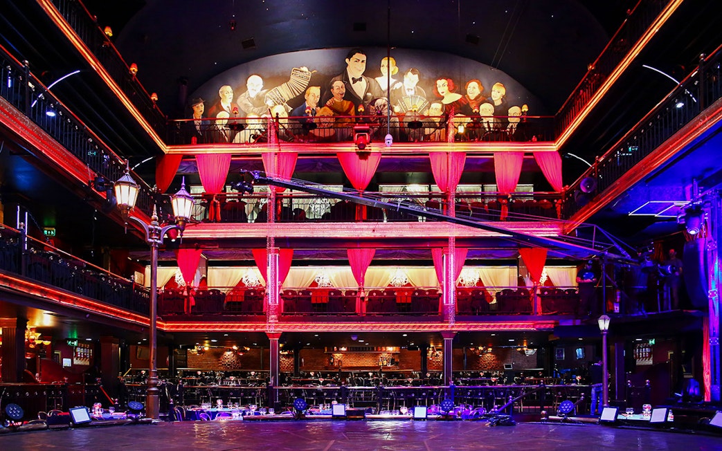 Señor Tango Show stage area with vibrant lighting and balcony seating.