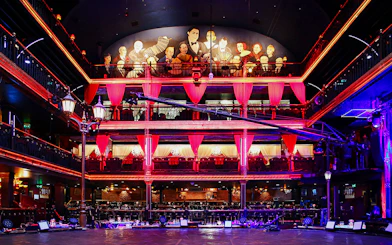 Señor Tango Show stage area with vibrant lighting and balcony seating.