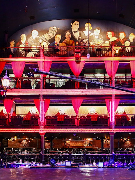 Señor Tango Show stage area with vibrant lighting and balcony seating.