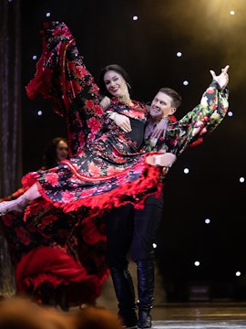 Flamenco dancers performing on stage in Córdoba, Spain.