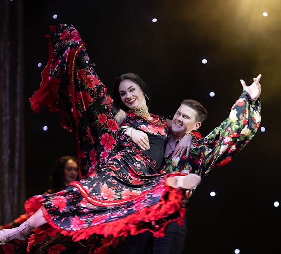 Flamenco dancers performing on stage in Córdoba, Spain.