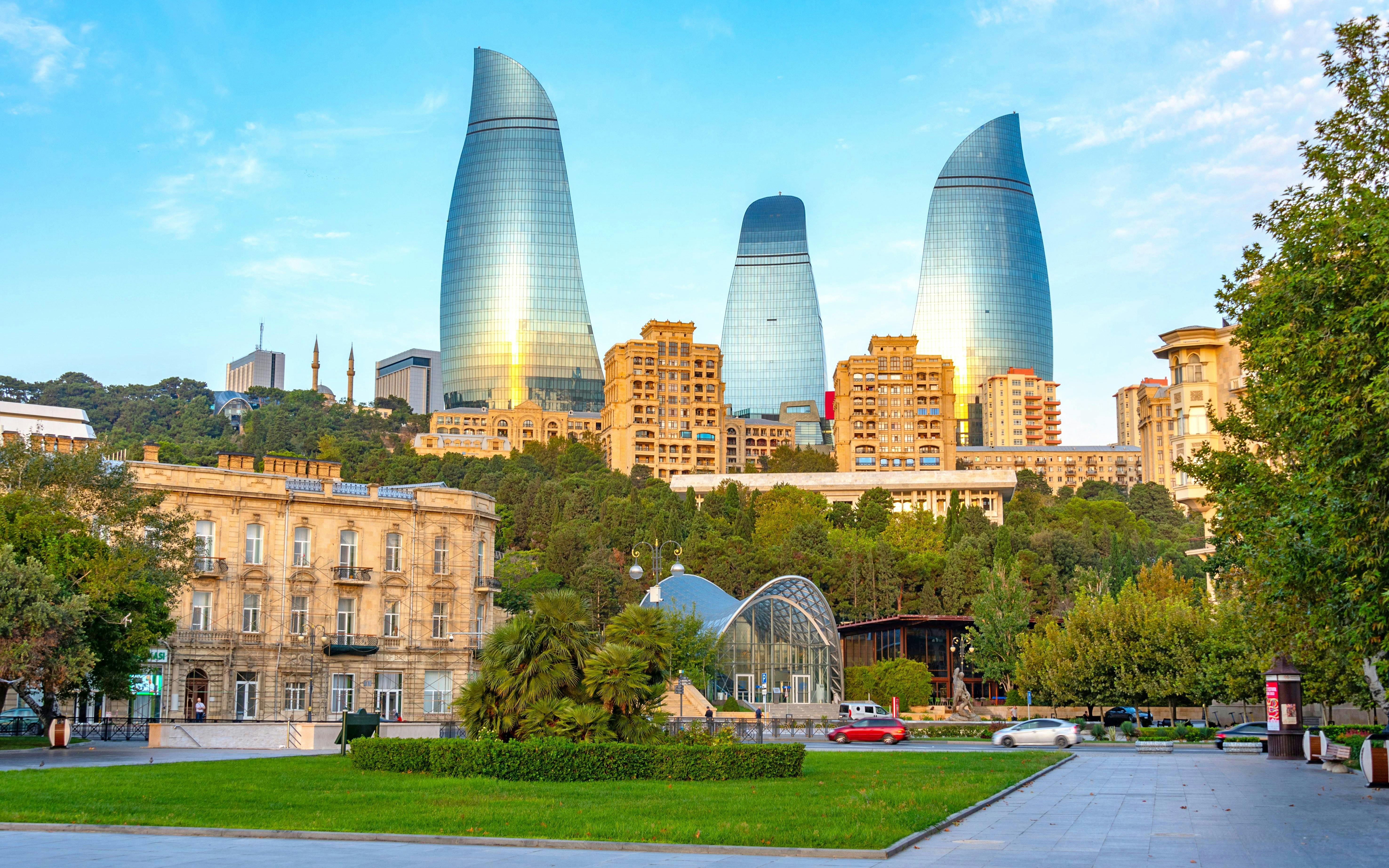 Sunrise view of Flame Towers and funicular station in Baku, Azerbaijan.