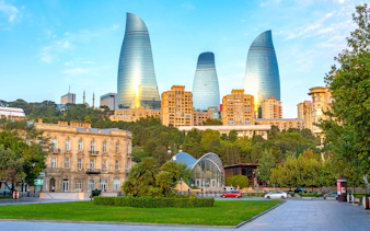 Sunrise view of Flame Towers and funicular station in Baku, Azerbaijan.