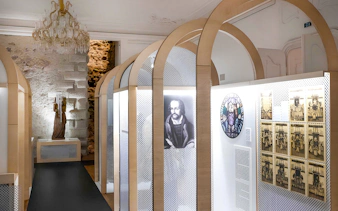 Exhibit inside Bratislava Castle featuring historical portraits and artifacts.
