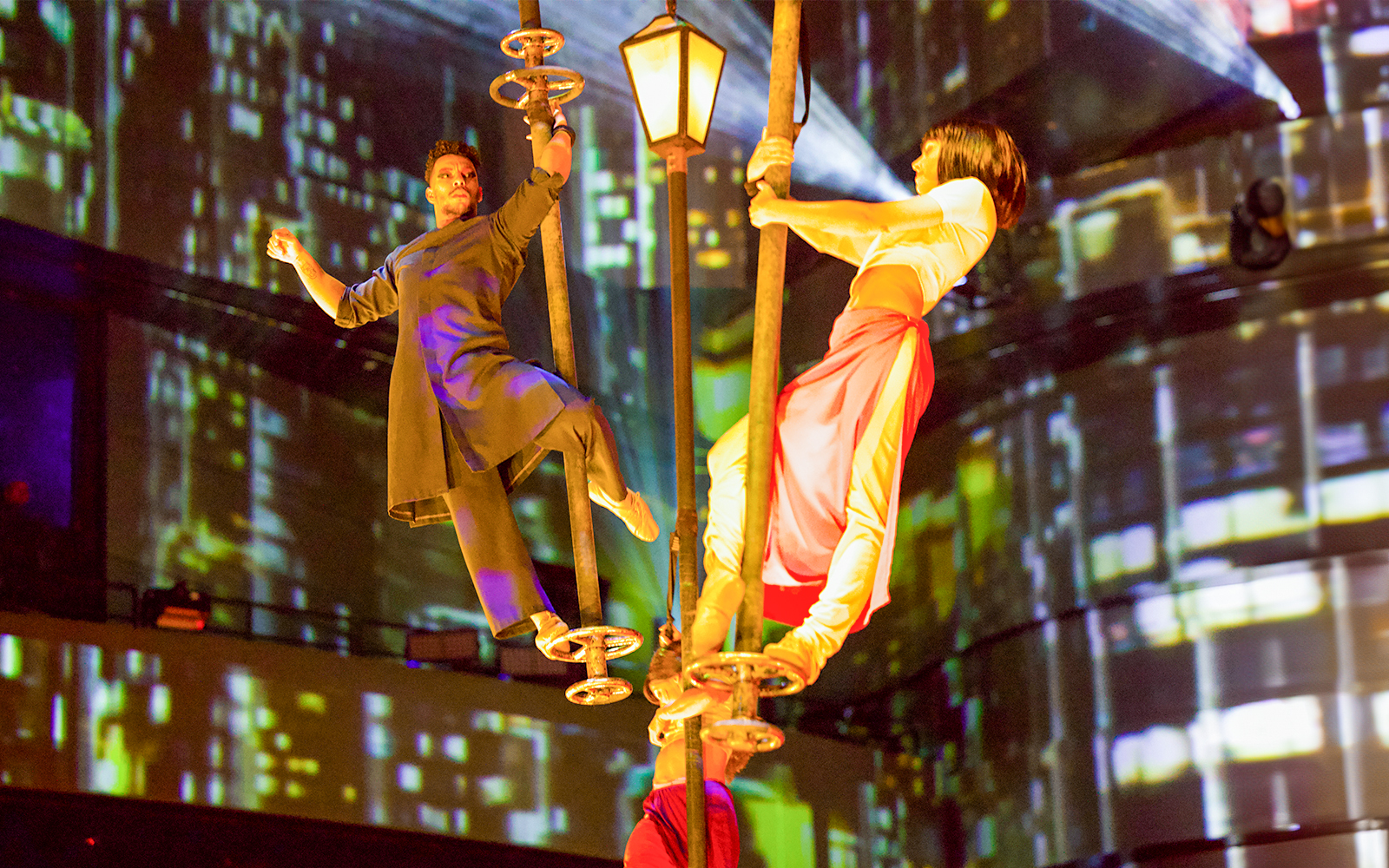 Performers on poles during La Perle By Dragone show in Dubai.