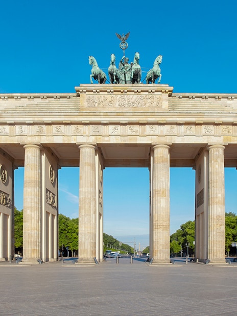Brandenburg Gate in Berlin with clear blue sky.