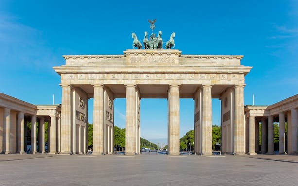 Brandenburg Gate in Berlin with clear blue sky.