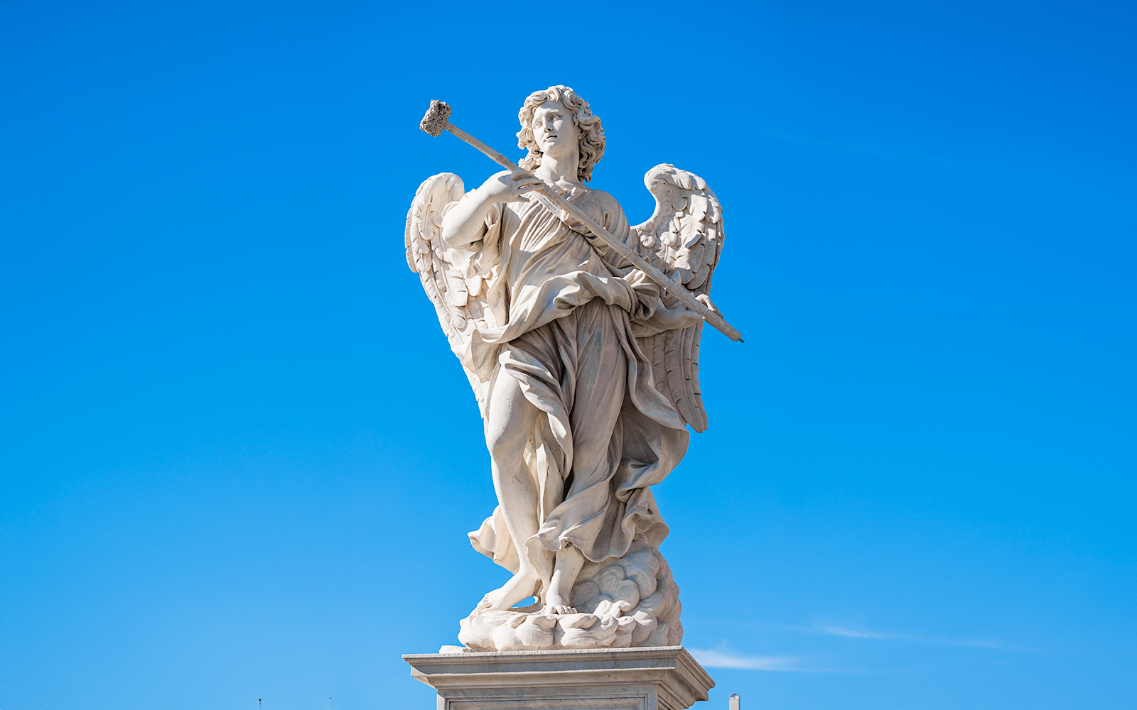 Angel with the Sponge statue by Antonio Giorgetti on Ponte Sant'Angelo, Rome, with Tiber River in background.