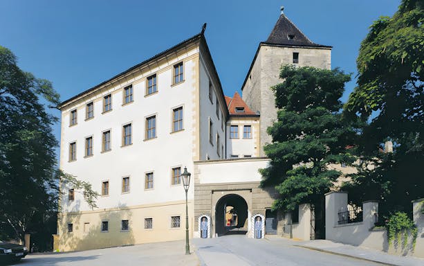 Lobkowicz Palace Museum exterior with visitors exploring historic architecture in Prague.