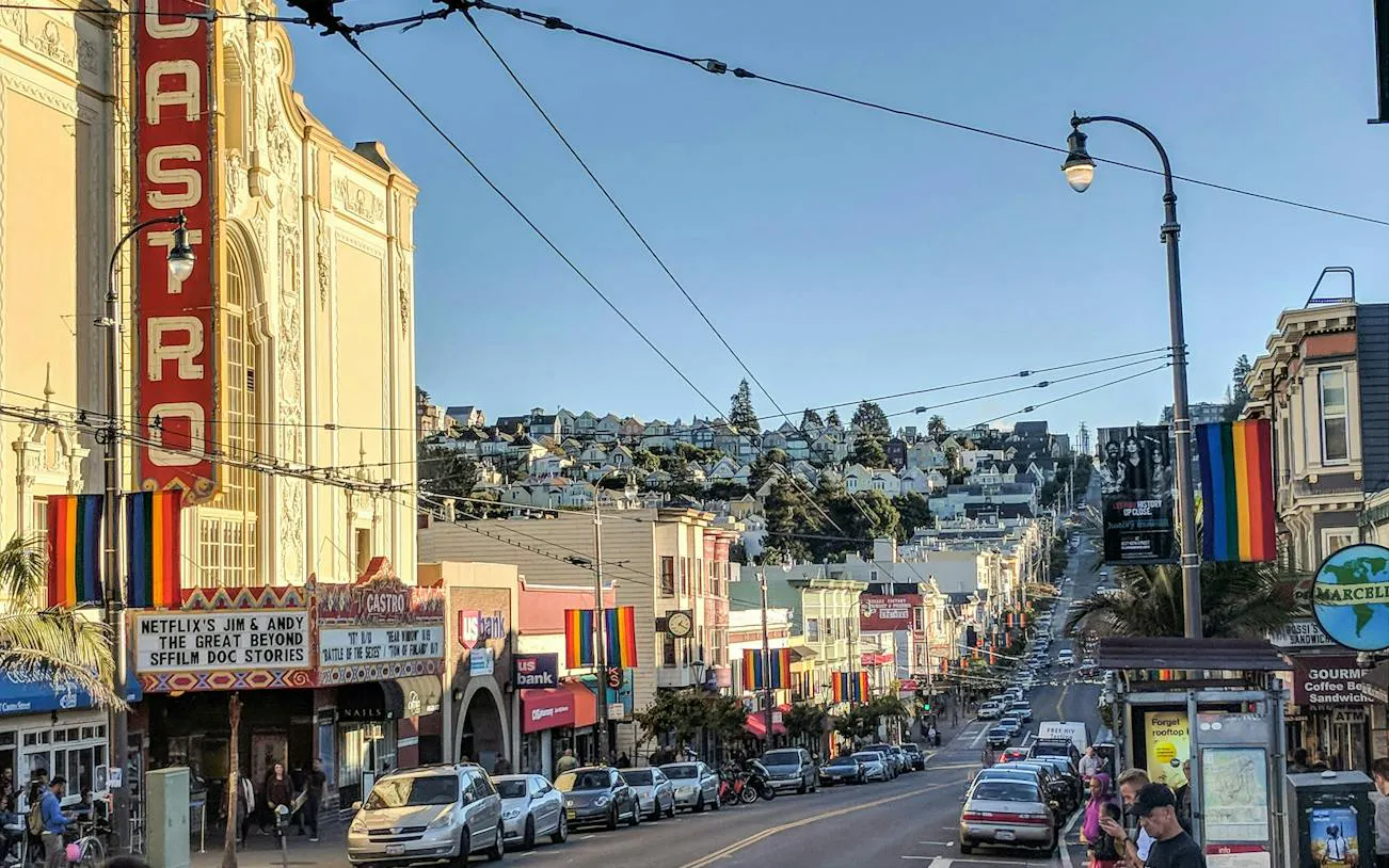 Castro Theatre and rainbow flags on Castro Street, San Francisco, part of self-guided city exploration game.