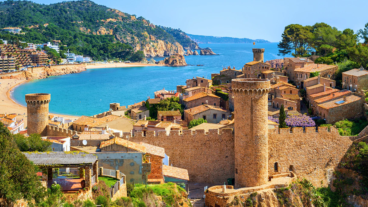 Tossa De Mar coastal view with medieval castle and beach in Spain.