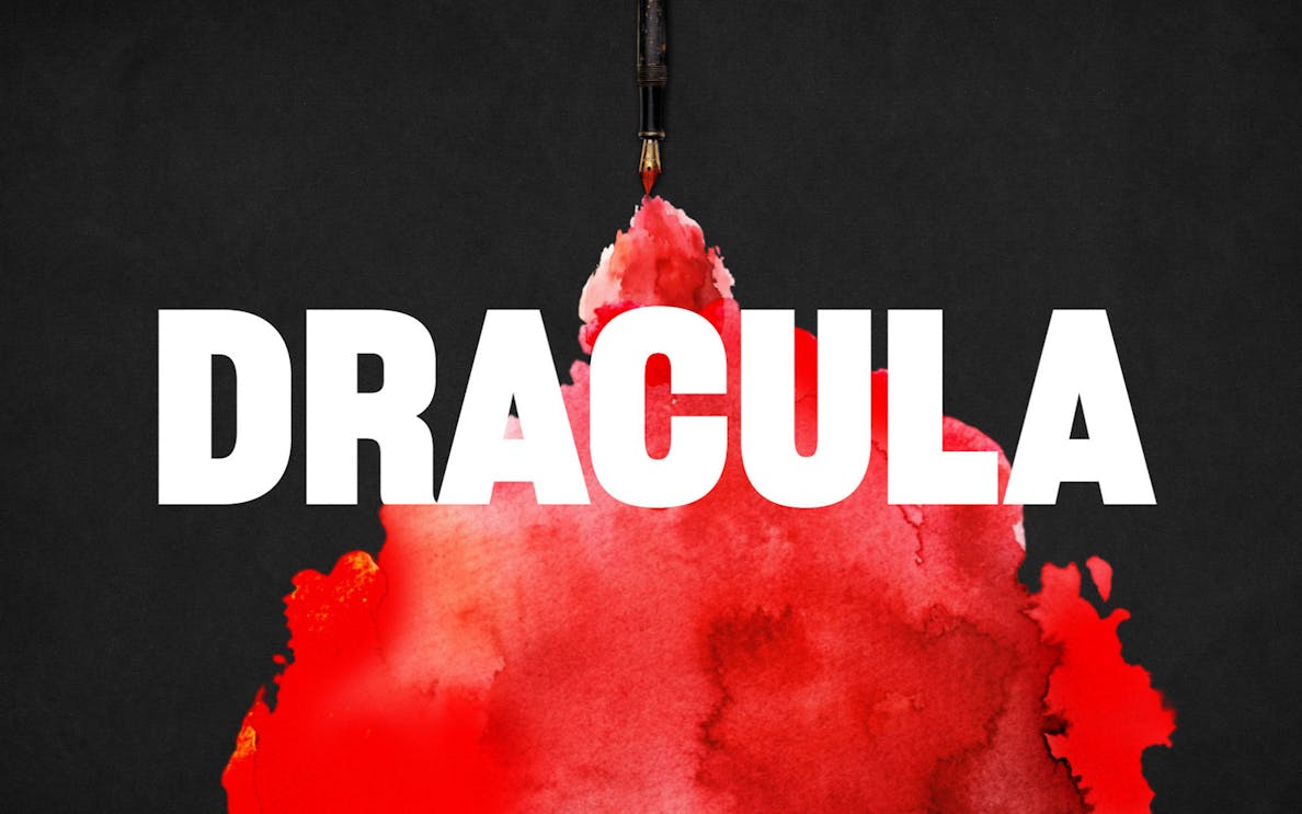 Dracula text with red ink blot on black background